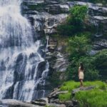 fascinating low angle shot female admiring waterfall doi inthanon park thailand - Magainepanda.com